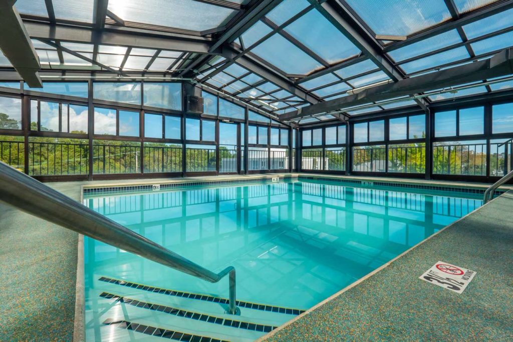 A corner view of indoor rooftop pool at the Breakers Hotel.