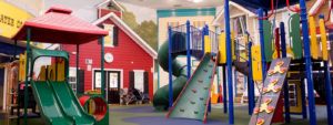 Double green slides, climbing walls, and playgrounds and kids cottage